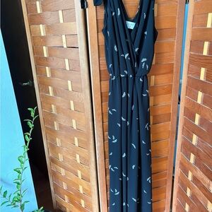 Elegant Black Sleeveless jumpsuit with Feather Print